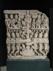 Latei die het karnen van de melkzee afbeeldt